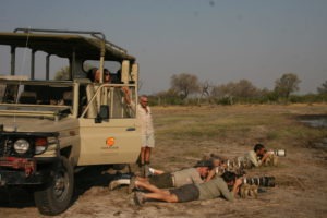 botswana photographic safari lyinf on floor