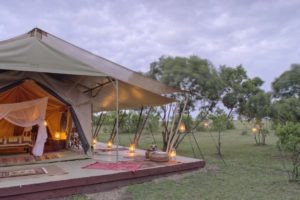 Saruni Wild double tent exterior at twilight Saruni Wild Masai Mara Kenya